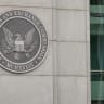 An emblem marks the entrance to the US Securities and Exchange Commission headquarters building, May 26, 2026, in Washington, DC. 