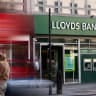 A bus drives past a branch of Lloyds Bank in London, Britain, January 28, 2026.