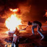 A protester in Aleppo burns tyres to protest the increase in fuel prices in Syria on the highway between Aleppo and Turkey, Syria, September 13, 2026.