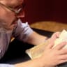 Dr. Chaim Meir Neria, curator of the Haim and Hanna Salomon Judaica Collection at the National Library of Israel, with one of the two volumes of the Lisbon Mahzor recently received by the Library.