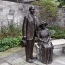 Statues of Henry and Clara Ford look over the garden at their historic Fair Lane home in Dearborn, Michigan, Sept. 2, 2026.