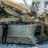 Palestinians walk past a destroyed Israeli armored vehicle left behind by the Israeli army during the recent war, in the Tel al-Hawa neighborhood of Gaza City, September 7, 2026.