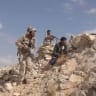 Iran-aligned Houthi fighters occupy a firing position in a screengrab from a video said to show Houthi fighters attacking Saudi-backed forces in the location given by the source as al Jawf governorate, Yemen.