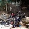 Migrants sit outside the CETI short-stay migrant center in the Spanish North African enclave of Ceuta in August. 