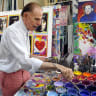Pop artist Peter Max poses in his New York studio on June 18, 2012 with seven portraits he created of Sir Paul McCartney to commemorate McCartneys 70th birthday.