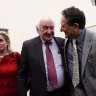 US Rep. Sandy Levin (D-MI) (2nd L) shares a moment with his son Rep.-elect Andy Levin (D-MI) (3rd L), who will succeed him in the 116th Congress, as Rep. Debbie Dingell (D-MI) (L), and Rep. Brenda Lawrence (D-MI) (R) look on after a news conference on auto jobs November 29, 2018; illustrative