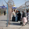 Afghan nationals carrying their belongings walk after crossing the border from Iran at the Islam Qala border crossing in Herat province, Afghanistan, September 3, 2026. 