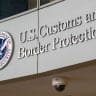A Department of Homeland Security US Customs and Border Protection sign is seen at their headquarters in the Ronald Reagan Building and International Trade Center on August 8, 2026 in Washington, DC.