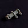 A close-up shows the exterior of the copper amulet container uncovered at Turkmen Karahoyuk in Konya, Turkey, July 26, 2026.