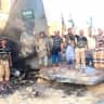 Houthi fighters stand in front of what they say is a downed Saudi jet, at a location given as Yemen, in this still image from a handout video released on September 16, 2026. 