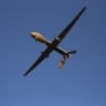 A US Air Force MQ-1B Predator unmanned aerial vehicle (UAV), carrying a Hellfire missile flies over an air base after flying a mission in the Persian Gulf region on January 7, 2016; Illustrative.