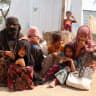Rawya Hassan, a mother of seven, sits with her children outside their hut at the al-Bireen camp for displaced people who fled fighting between the Houthis and forces of Yemen's internationally recognized government in Taiz province, Yemen, September 17, 2026.