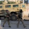 A foreign security expert arrives at the scene of a suicide explosion targeting the African Union Mission in Somalia (AMISOM) convoy in Mogadishu, Somalia November 11, 2021; illustrative.
