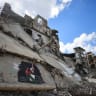 A Palestinian walks near a mural painted in honour of American rapper Macklemore, amid buildings destroyed during the war, in Gaza City, September 18, 2026.