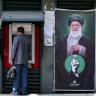 A man uses an automated teller machine (ATM) from Bank Mellat in Tehran on September 7, 2026. 