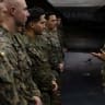 US Navy Admiral Brad Cooper, commander of US CENTCOM, speaks with crew members of the America-class amphibious assault ship USS Tripoli, deployed to the US 5th Fleet area of operations to support maritime security in the Middle East, in this handout photo released May 3, 2026. 