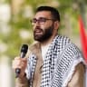 Palestinian photojournalist Motaz Azaiza speaks to the crowd at the end of the 14th national march for Palestine on May 18, 2024 in London, England.