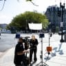CNN Senior White House Report Betsy Klein during a television report on a street corner outside the White House grounds after earlier being denied entry, on September 19, 2026 in Washington, DC.