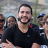 Democratic candidate for US Senate Abdul El-Sayed poses with union members from UAW Local 51 during the Labor Day Parade in Detroit, Michigan, US, September 7, 2026.