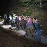 Rescue teams descend into ravine near Bohinj area of northwestern Slovenia to locate Israeli father and son who had fallen during a hiking accident.