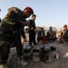 Iraqi forces and Kurdish Peshmerga fighters gather during a security deployment in Luhaiban village in Kirkuk Monday, 6th December 2021