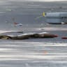 A shotgun and shotgun shells lie on the ground at the scene of a shooting where a police officer was shot outside a Yom Kippur gathering at Sons of Jacob Synagogue in Belleville, Ontario, Canada, September 21, 2026.