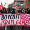 Demonstrators hold a banner urging the Football Association of Ireland (FAI) to boycott upcoming UEFA fixtures with Israel, in support of Palestinians during a protest in relation to the ceasefire in Gaza, in Dublin, Ireland, February 21, 2026. 