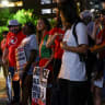 Activists hold an emergency protest a day after an Immigration and Customs Enforcement (ICE) agent shot and wounded a man from Venezuela who, according to his lawyer, was working as a DoorDash driver, at the Texas State Capitol in Austin, Texas, US, September 21, 2026.