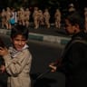 Young children carrying military-style weapons are seen during street parades conducted by military forces of the Islamic Republic of Iran, who provide military training to supporters in preparation for a potential conflict with the United States and Israel, on September 18, 2026, in Tehran, Iran.