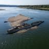 This aerial photograph shows the wreckage of a World War II German warship, one of dozens sunk by retreating Nazi forces in September 1944, emerging from the low waters of the Danube River near Prahovo, Serbia, on August 11, 2026.