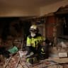 A member of the ECU-11 Guayaquil Fire Department from Ecuador takes part in rescue efforts inside a building that collapsed from the ground floor to the fifth floor, following major earthquakes, in La Guaira, Venezuela, June 29, 2026.
