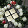 Roses are laid at Stolpersteine (stumbling stones) commemorating relatives of Israeli ambassador to Germany Ron Prosor, Elfriede, Berthold, Liselotte and Ulrich Proskauer during a Stolpersteine laying ceremony in Berlin on September 23, 2024. 