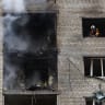 Firefighters work at the site of an apartment building which was hit by a Russian jet drone strike, amid Russia's attack on Ukraine, in Kyiv, Ukraine September 25, 2026.