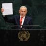 Prime Minister Benjamin Netanyahu holds up a Starlink device as he speaks during the 81st United Nations General Assembly at the United Nations Headquarters in New York, on September 24, 2026. 