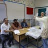A woman casts her ballot as she votes during Morocco's legislative elections at a polling station inside a school at the Udayas neighborhood in Rabat on September 23, 2026. 