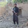 A Taliban security personnel stands guard near a damaged house, after Pakistani airstrike struck Gurbuz district in Afghanistan's Khost province on September 24, 2026.