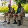 Members of the Tigrayan forces sit along a street as they patrol as tensions intensify after the forces launched a major offensive against the federal government in multiple locations, in Mekele, Tigray Region, Ethiopia, September 24, 2026.