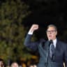 Serbian President Aleksandar Vucic waves to citizens outside the Presidency of Serbia moments before formally submitting his resignation, ending his second and final five-year term in office, in Belgrade, Serbia, September 27, 2026.