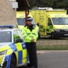 Emergency vehicles are parked at Fairford Youth Football club, near RAF Fairford, which hosts US Air Force personnel, in Fairford, Gloucestershire, Britain, September 27, 2026. Police declared a major incident at UK's Fairford air base after several men were arrested on suspicion of offences under t
