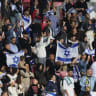 ISRAEL FANS at Nagyerdei Stadion, Debrecen, Hungary, wave flags after the match of the blue-and-white 3-0 loss to Ireland in Nations League action.