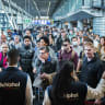 Travelers wait in a departure hall at the Netherlands's Schiphol airport, a day after a strike by KLM luggage handlers caused many flights to be canceled, near Amsterdam, April 24, 2022