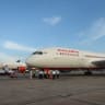 Air India's first Boeing 787 Dreamlinter (R) aircraft from Charleston, USA, is parked on the tarmac at Indira Gandhi International airport's terminal T-3 in New Delhi, on September 8, 2012.