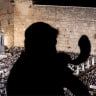 A rabbi blows a shoat ahead of Yom Kippur at the Western Wall in Jerusalem in 2026.