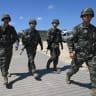 South Korean Marines walk across a training area during a Combined Joint Logistics Over-the-Shore (CJLOTS) and Combat Service Support Area (CSSA) operations as part of a joint field training exercise conducted by South Korea-US Combined Forces Command in Pohang on July 15, 2026. 