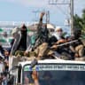 Supporters of a political group cheer after destroying a vehicle believed to contain firearms during the first parliamentary elections of the Bangsamoro Autonomous Region in Muslim Mindanao (BARMM), outside Sero Central Elementary School, Cotabato City, Philippines, September 14, 2026.