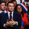 Jordan Bardella, president of the French far-right Rassemblement National (National Rally - RN) political party, listens to the speech of Marine Le Pen, French far-right leader and member of parliament, in Henin-Beaumont, northern France, September 13, 2026. 