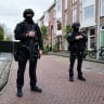 (illustrative) Police officers stand guard as authorities dismantle a large drug lab discovered in a residential area on July 18, 2026 in The Hague, Netherlands. 