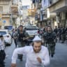 Israeli police clash with ultra-Orthodox Jewish men during a police operation in the ultra-Orthodox neighborhood of Mea Shearim in Jerusalem, September 14, 2026. 