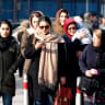 Iranian women wearing hijab walk down a street in the capital Tehran on February 7, 2018.