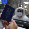 An Israeli man presents his passport for control upon arrival from Tel Aviv to the Dubai airport in the United Arab Emirates, on November 26, 2020, on the first scheduled commercial flight operated by budget airline flydubai, following the normalisation of ties between the UAE and Israel.